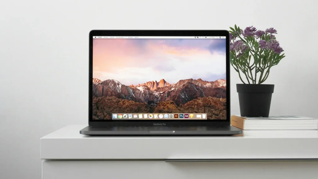 A MacBook on a white table