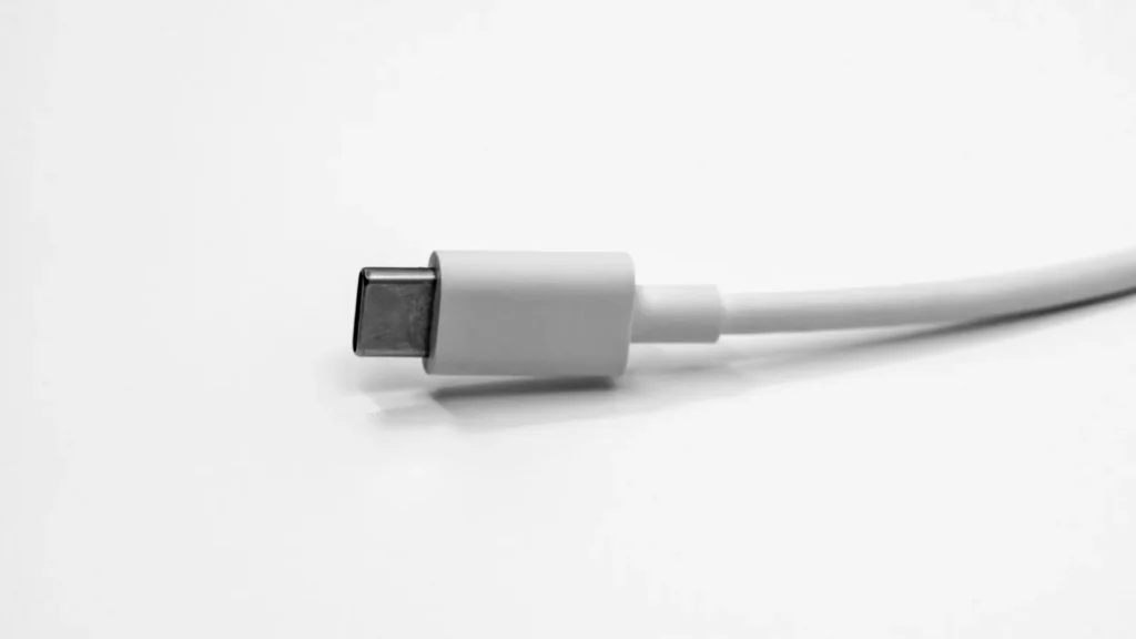 A white connector cable on a white desk